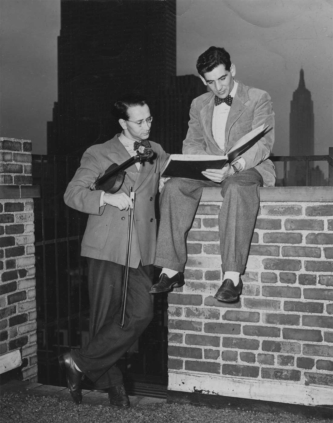 Werner Lywen and Leonard Bernstein discussing on City Center roof Werner Lywen and Leonard Bernstein discussing on City Center roof