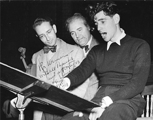 Werner Lywen and Leonard Bernstein studying a score